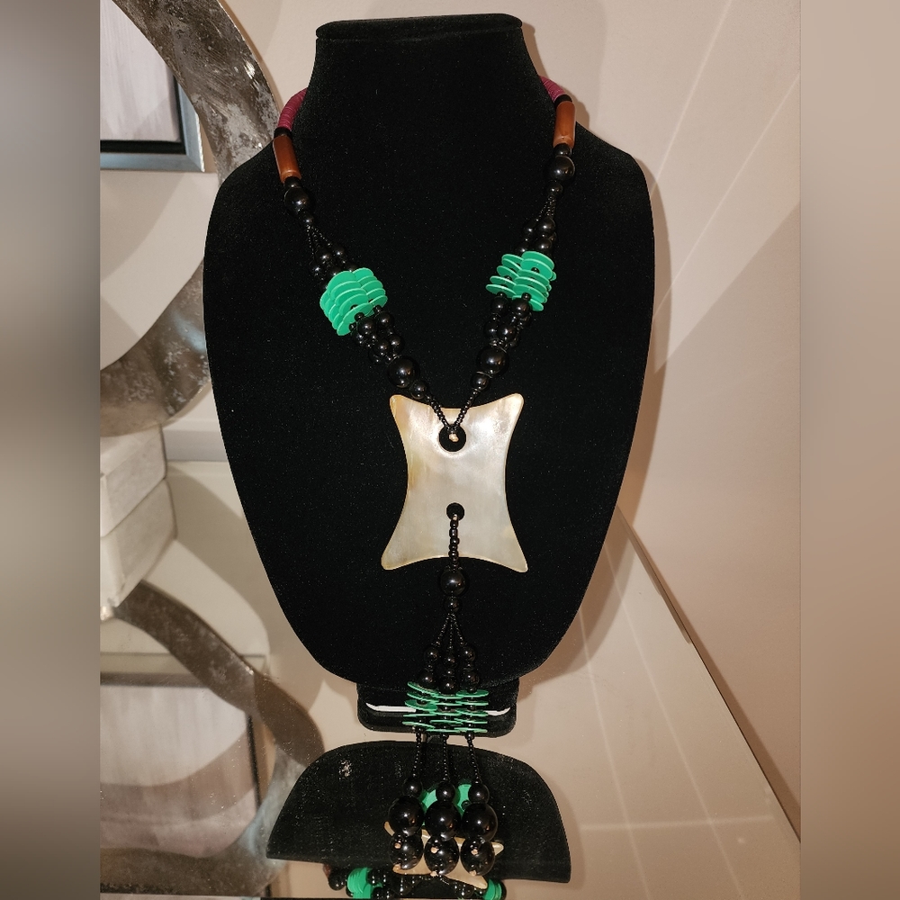 Black & Green beaded necklace with bone pendant. Handmade in Ghana.